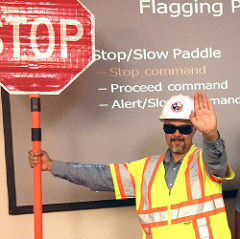 flagger and diagram of work zone