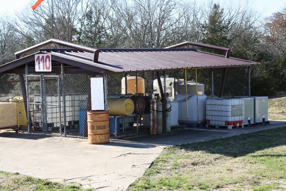 many containers under a metal awning
