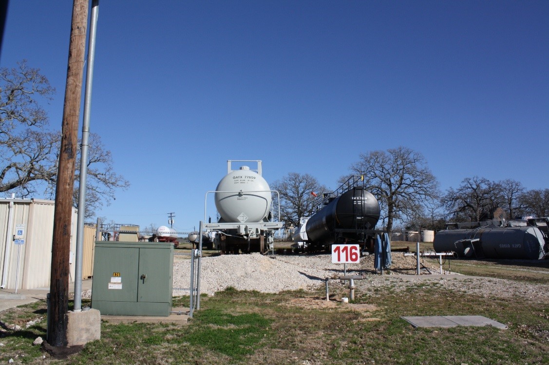 two train cars stopped at a terminal