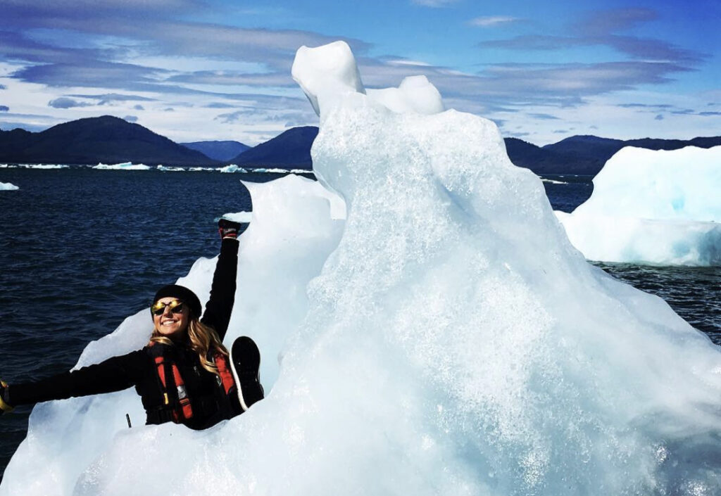 Larkin Bohn sitting on a iceberg
