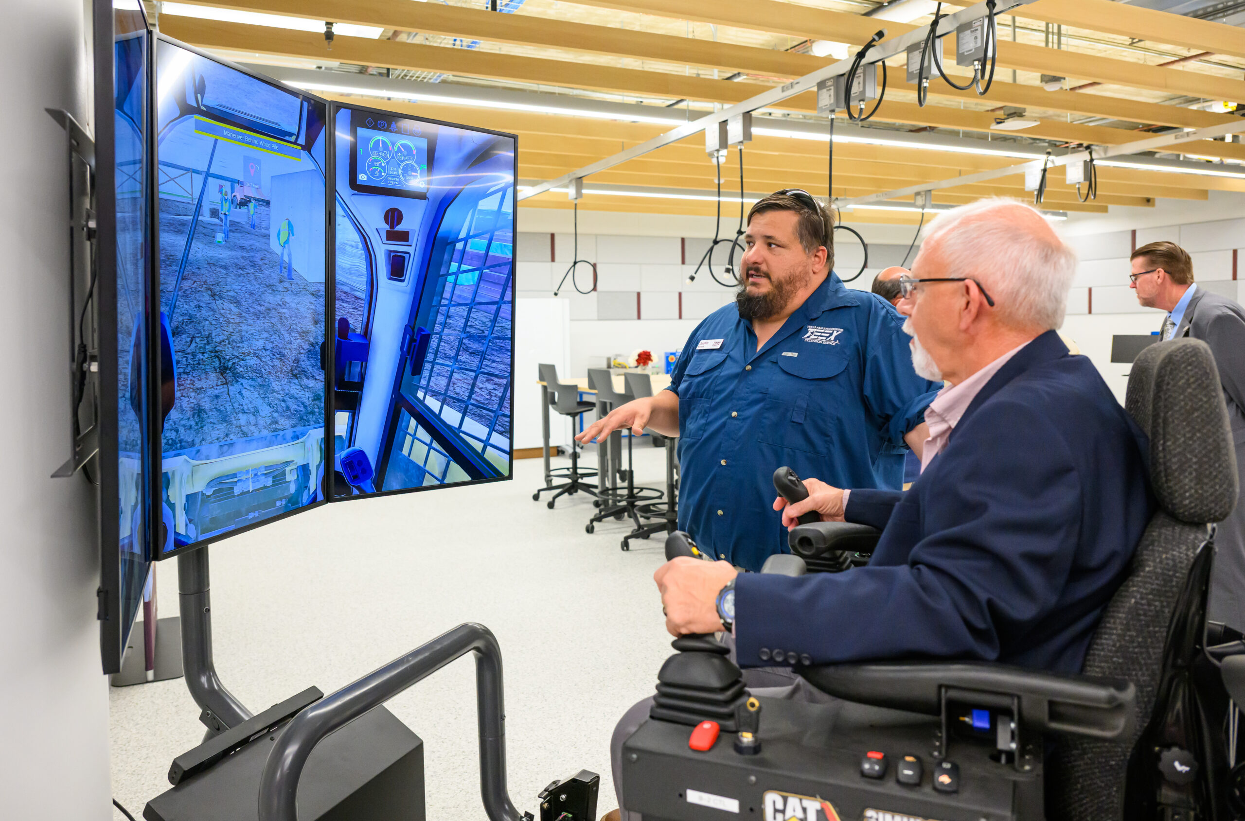 two men with a driving simulator machine