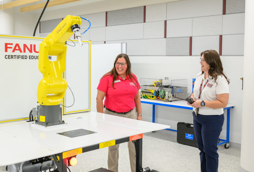 two women with a robotic machine