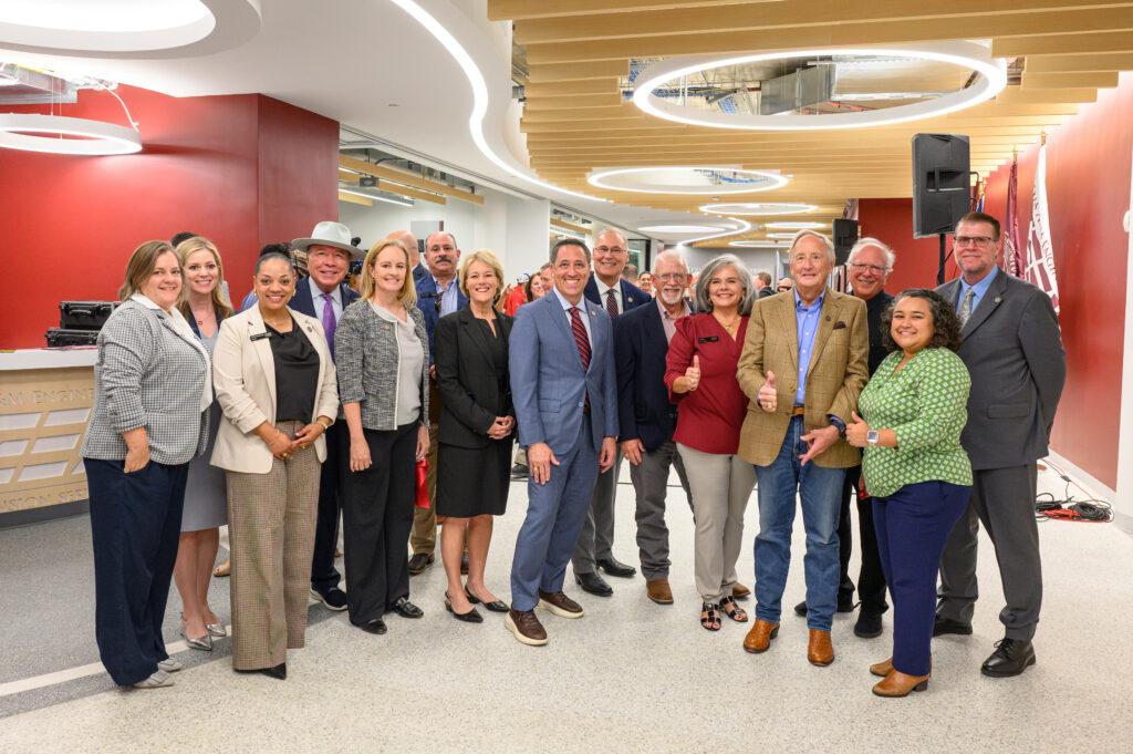 a group of people smiling for a camera