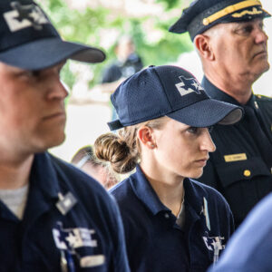 Male and female police officer cadet standing