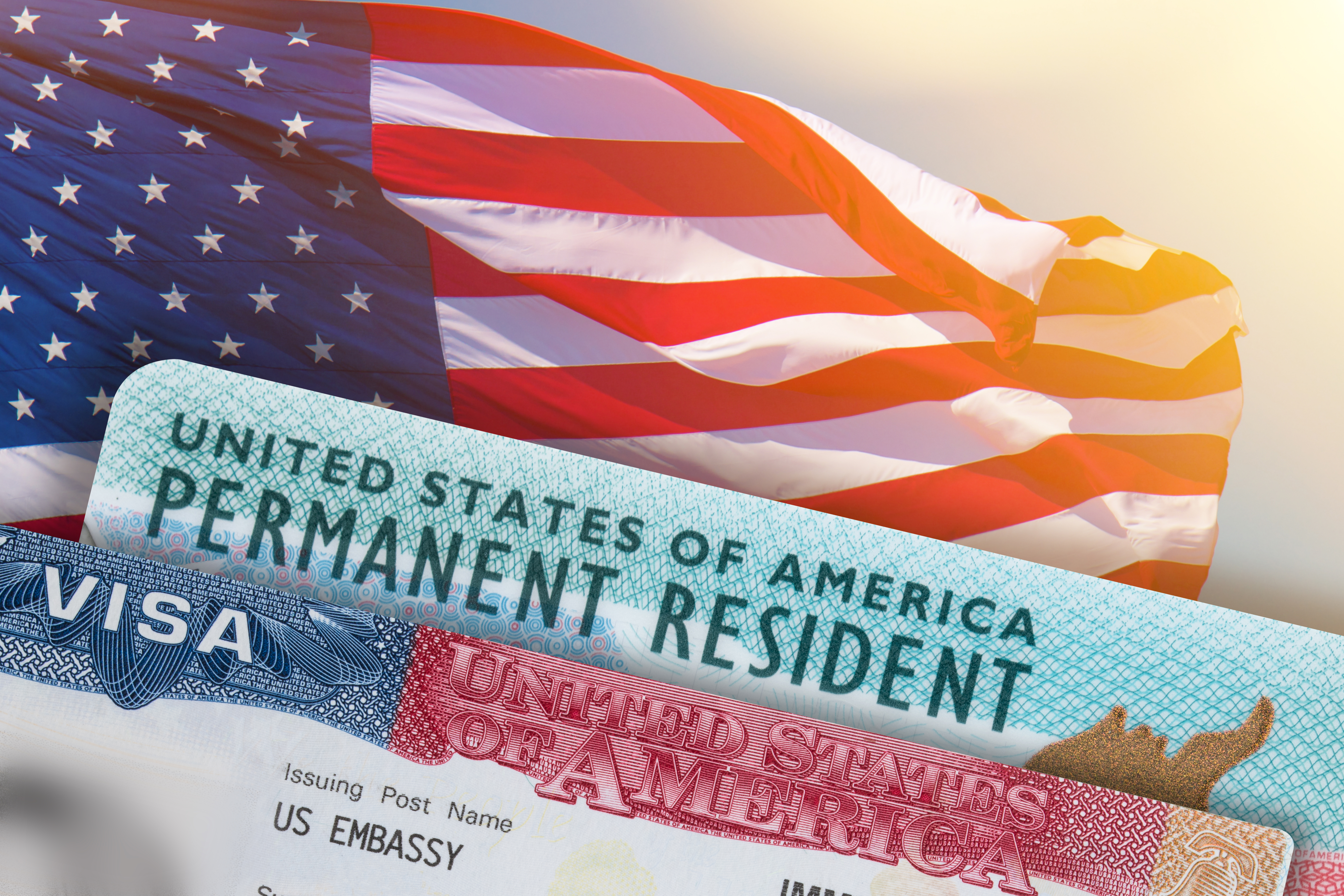 American flag, permanent resident card, and visa authorization