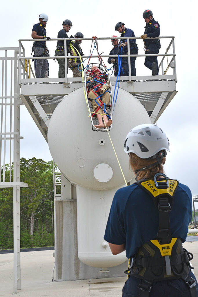 Girl rescuing a dummy from a metal prop