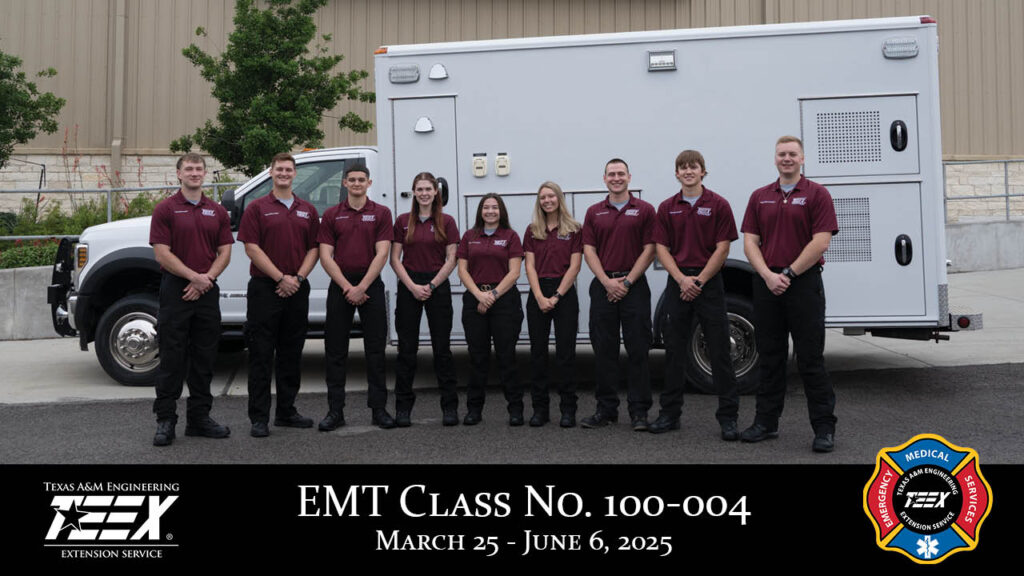 EMS students lined up in front of ambulance