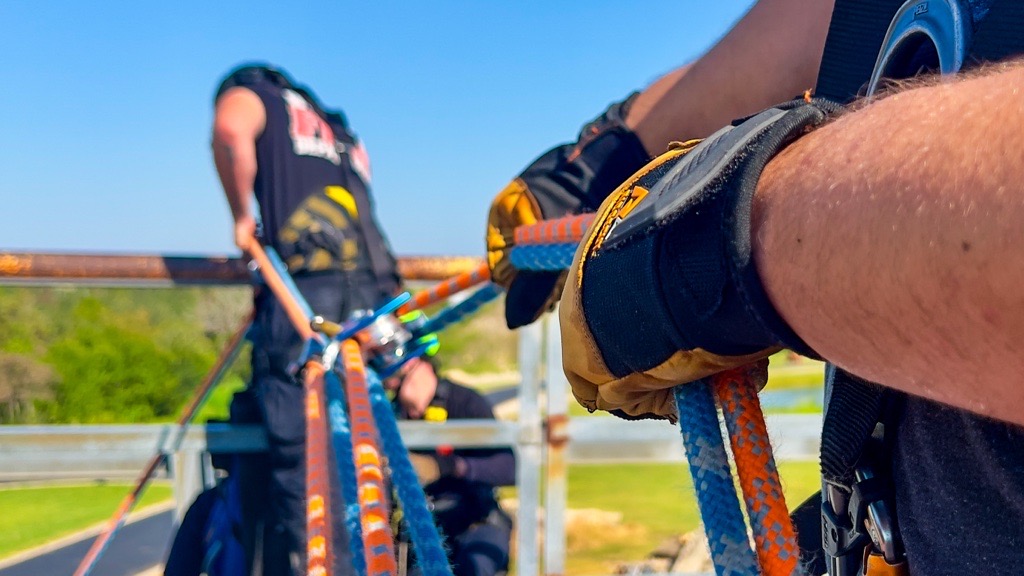 two people holding a rope