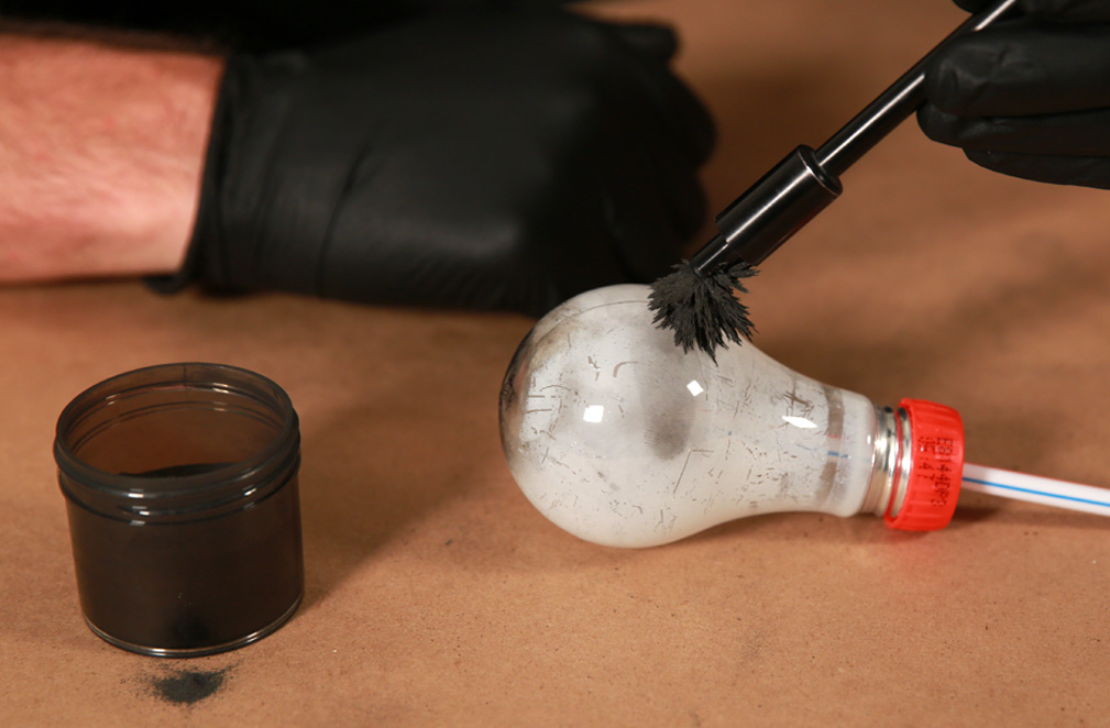 Processing fingerprint on lightbulb using magnetic powder