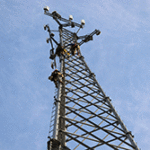 Men climbing on cell tower