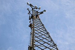 Men climbing on cell tower