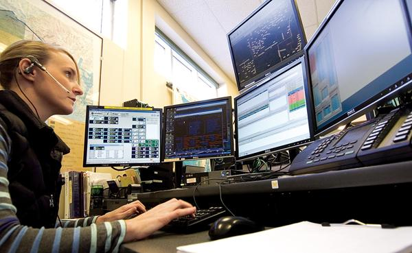 Telecommunicator working at her desk