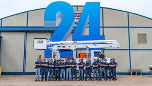 Photo of TEEX Lineworker Academy Class 24 in front of Utilities Training Hangar