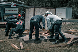 Rescuers looking at rubble