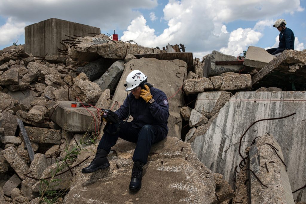 Matt Winn and George Botello demonstrating how a Delsar life detector system uses acoustic sensors to assist in the search for live victims trapped in a collapsed structure in Disaster City.Credit...Tamir Kalifa for The New York Times