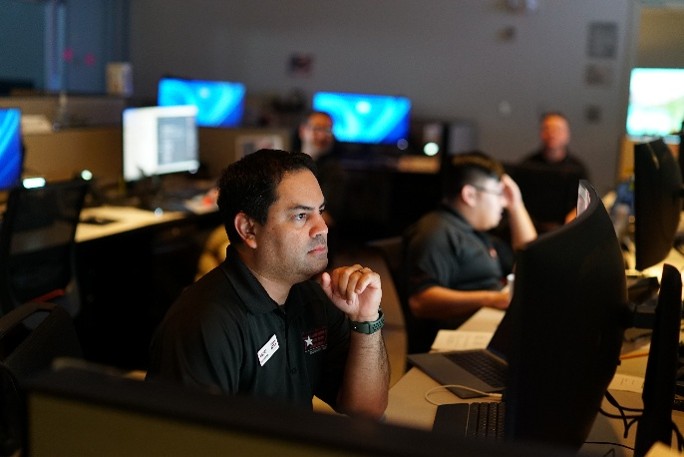 man sitting at computer