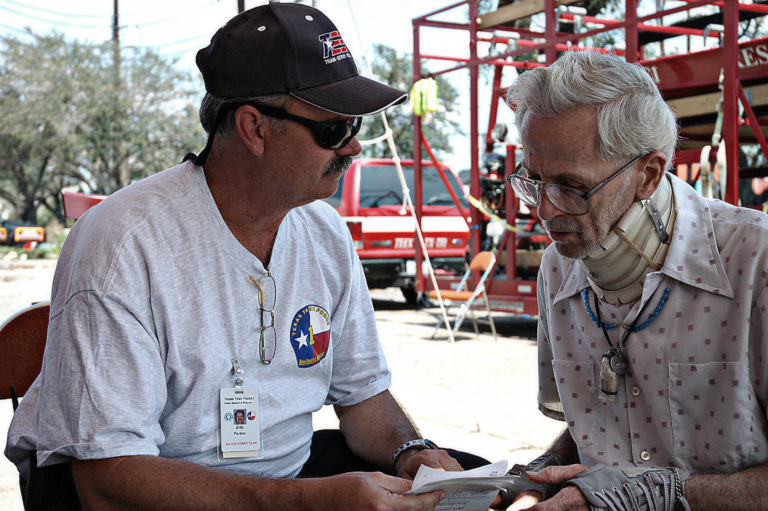 Billy Parker speaking to Older Man