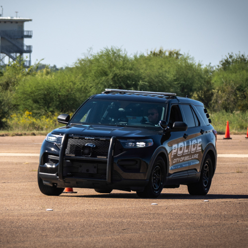 A police squad car completing evasive maneuvers.