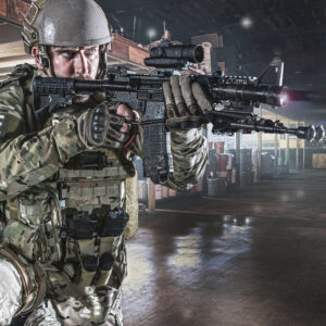 Male SWAT officer if full gear and holding gun