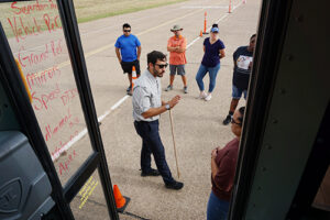 TEEX instructor explains 90 degree turns to SchoolBus Driver course participants.