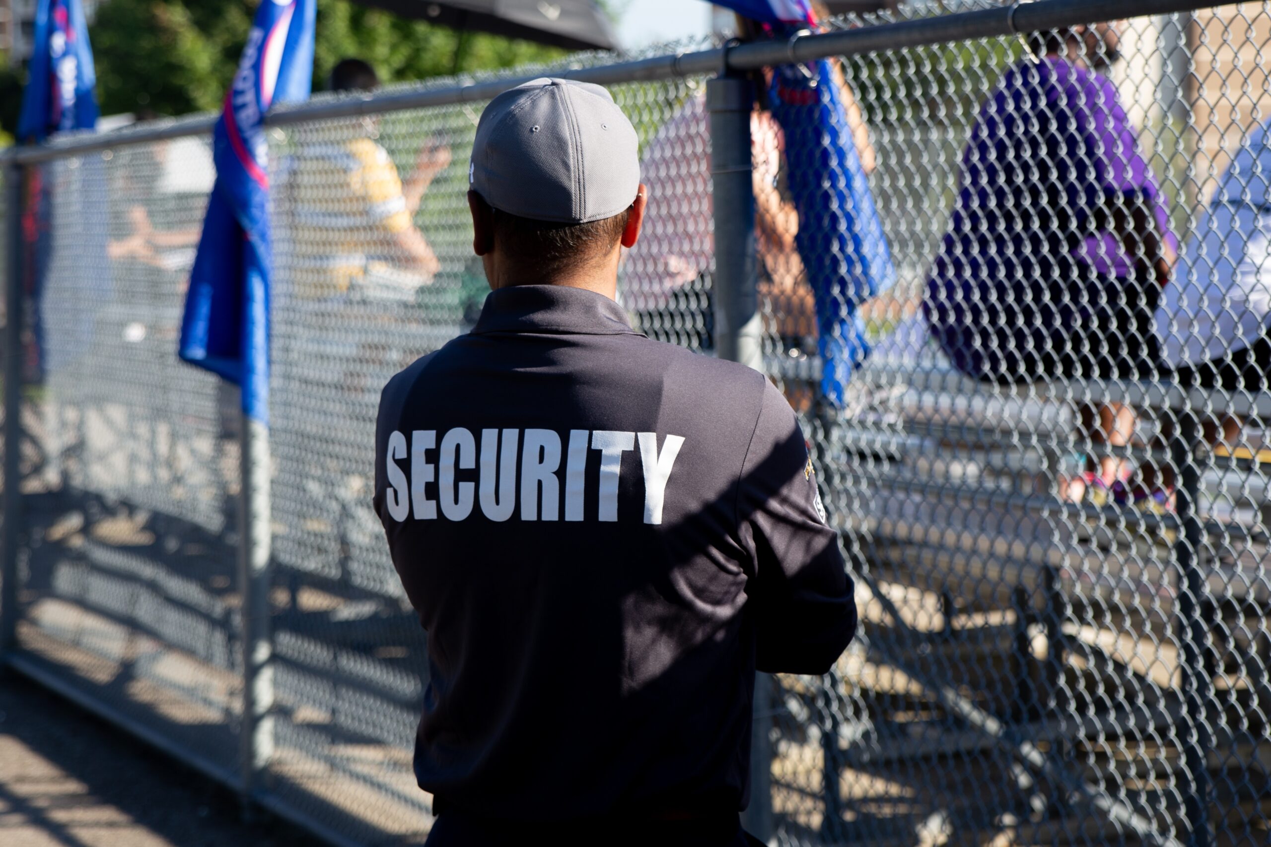 Male security guard patrolling an outdoor event