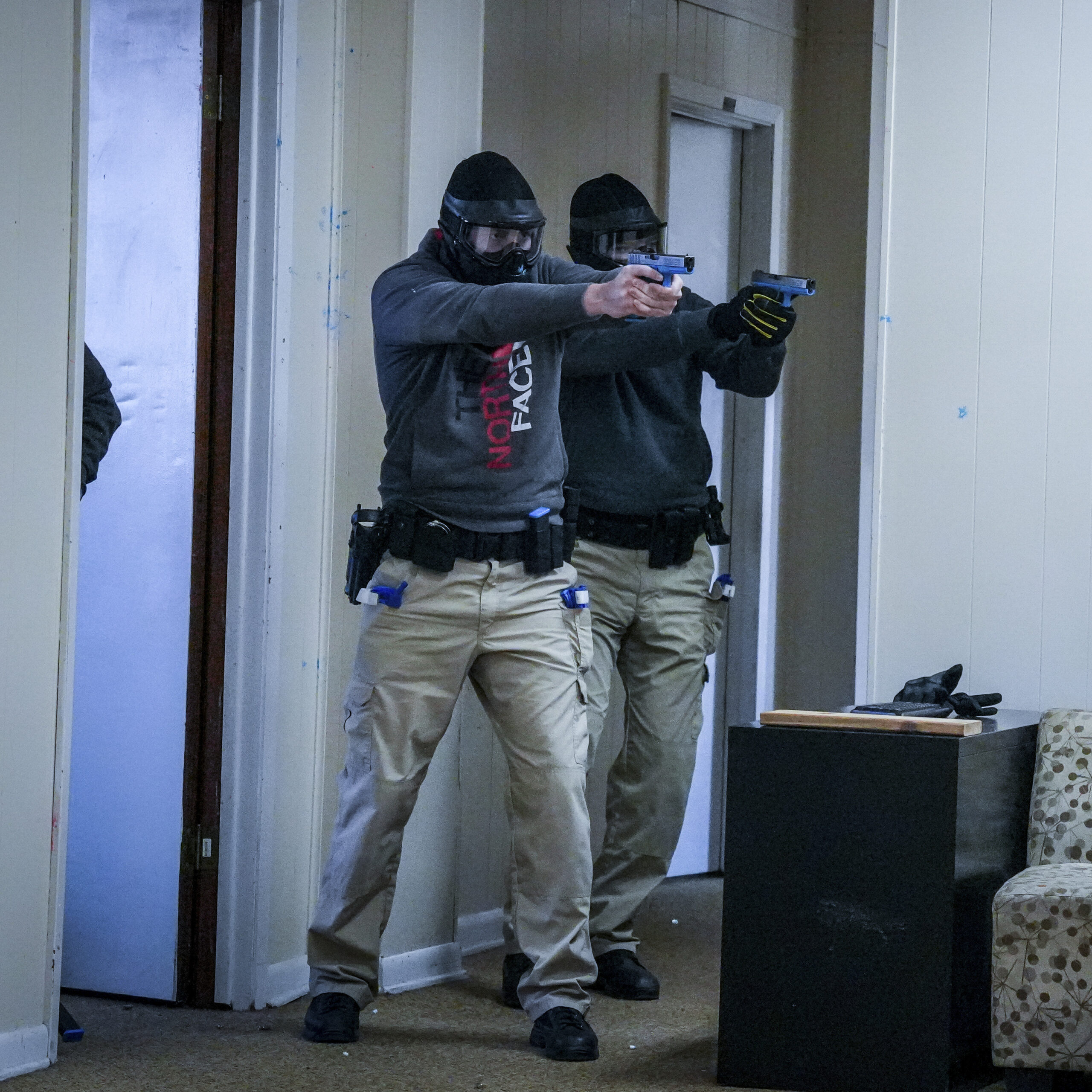 Officers with guns during a training exercise