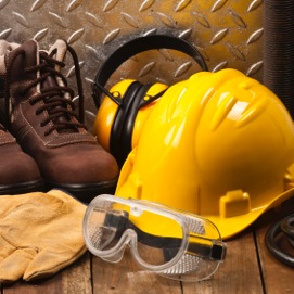 yellow hard hat with work boots and safety glasses