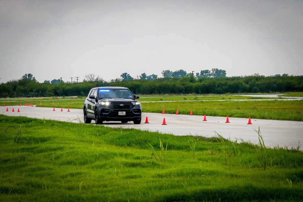 emergency vehicle driving on the newly opened drive track at the public service training complex.